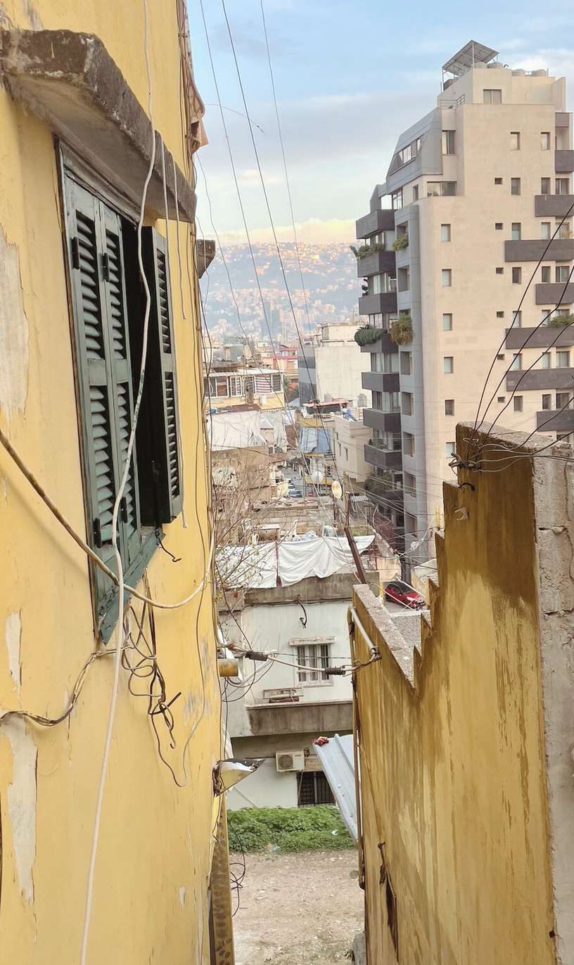 A yellow wall above the rooftops